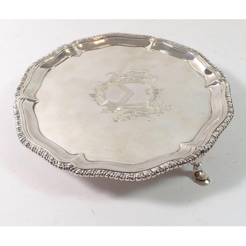 328 - A Georgian silver card tray with armorial, on three hoof feet, London 1765 by Hannam & Crouch, 291g,... 