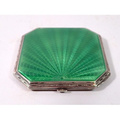 336 - A silver and green enamel Art Deco sun ray compact, Birmingham 1935