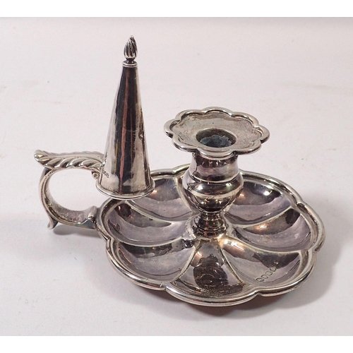 343 - An early 19th century small silver chamber stick with fluted base, London 1836 and matched snuffer, ... 