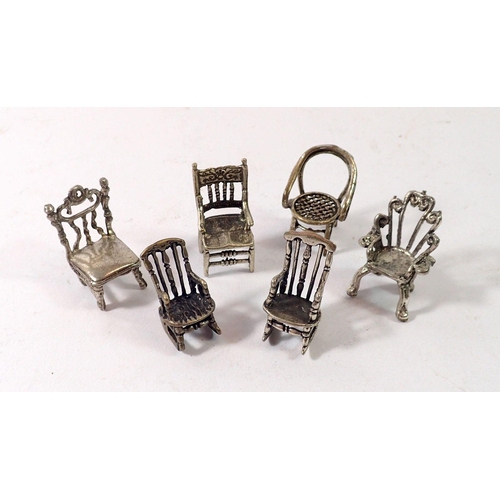 352 - A collection of six various Italian white metal miniature dolls house chairs