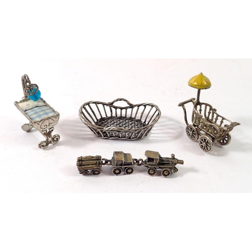 356 - An Italian white metal miniature dolls house crib basket, pram, rocking crib and toy train, train 6c... 