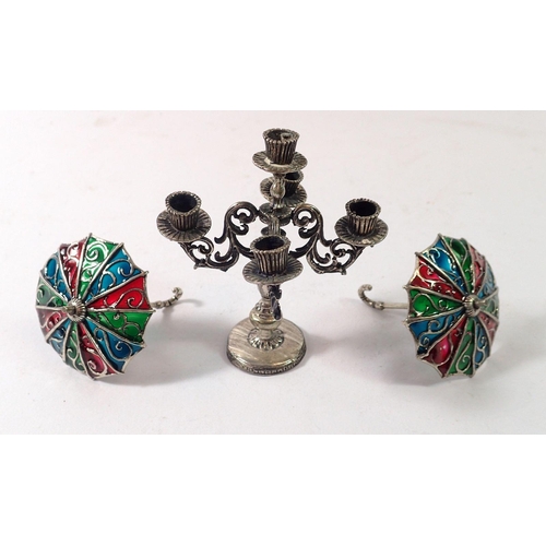 357 - Two miniature Italian white metal and enamel umbrellas and a dolls house candleabra 7.5cm tall