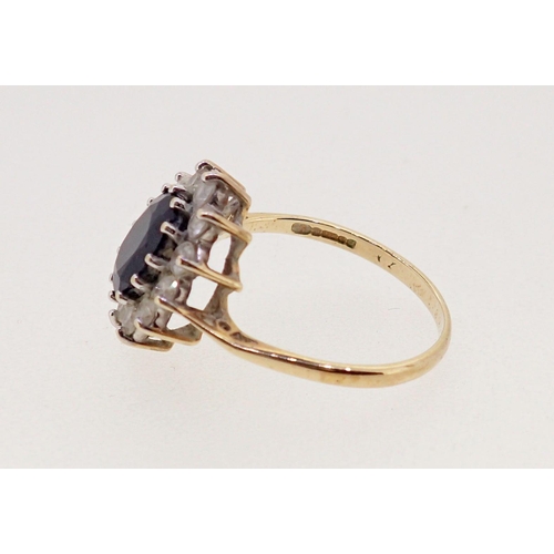 365 - A 9 carat gold ring set cubic zirconium and blue stone - a/f, size K, 2.2g