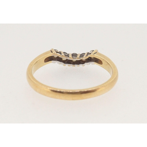 366 - An 18 carat gold ring set curved line of five diamonds, size P, 3.2g