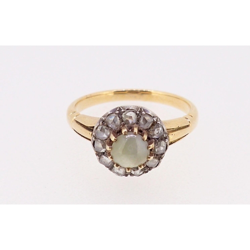 381 - An antique unmarked gold ring set diamond and pale green stone cluster, size P, tested as 18ct gold