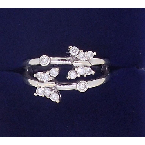 387 - An 18ct white gold split shank ring with two diamond set butterflies, 4.9g, size N to O