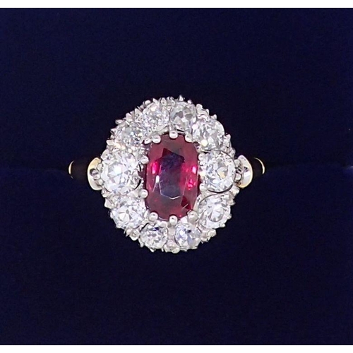 388 - A fine 18ct gold ruby and diamond oval cluster ring, the ruby 7mm x 4mm approx., size M, 4.8g