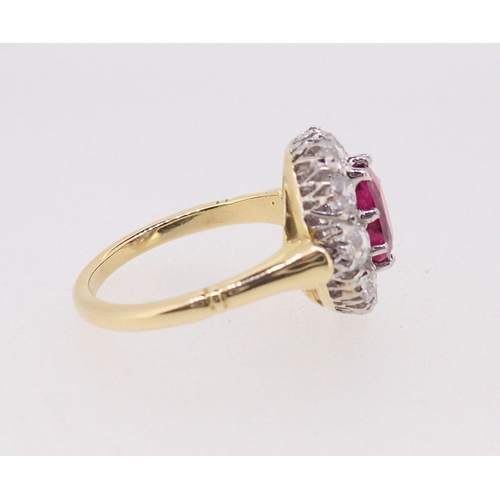 388 - A fine 18ct gold ruby and diamond oval cluster ring, the ruby 7mm x 4mm approx., size M, 4.8g