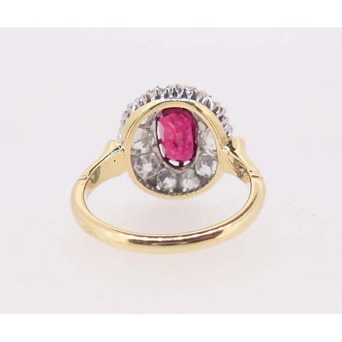 388 - A fine 18ct gold ruby and diamond oval cluster ring, the ruby 7mm x 4mm approx., size M, 4.8g