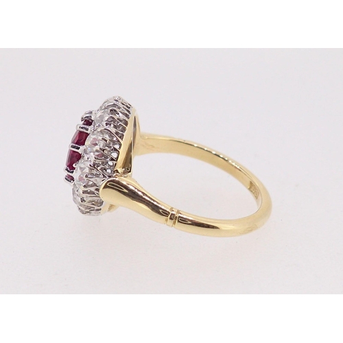 388 - A fine 18ct gold ruby and diamond oval cluster ring, the ruby 7mm x 4mm approx., size M, 4.8g