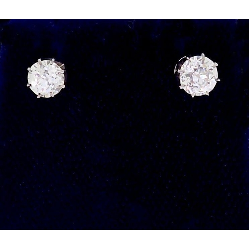 393B - A pair of white gold set diamond stud earrings, just under one carat in total