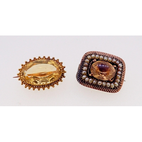 396 - An oval gold and citrine brooch unmarked 21cm wide and an early 19th century mourning brooch set cit... 