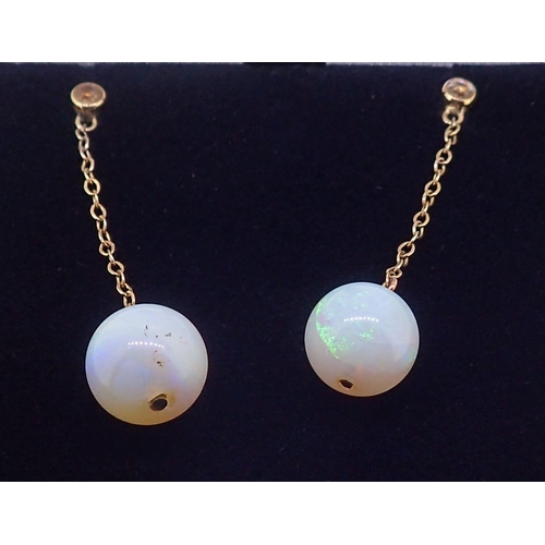 397 - A pair of 18 carat gold and opal bead pendant earrings, 2.8cm drop