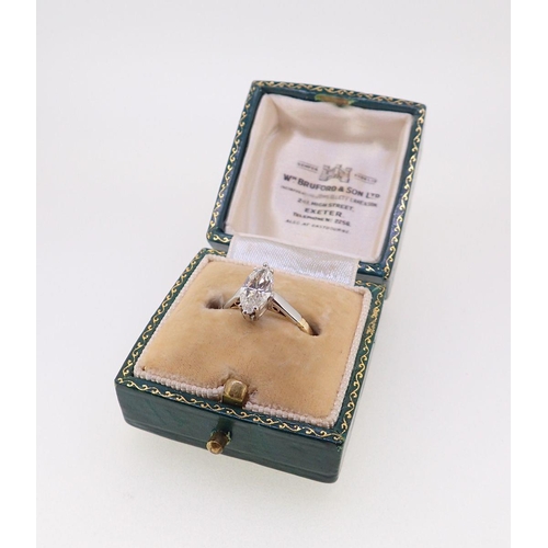 402 - An 18 carat gold and platinum set marquise cut diamond ring, approximately one carat, size L, boxed