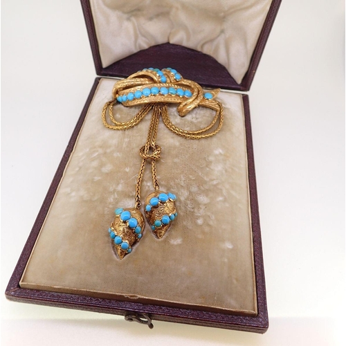 411 - A Victorian gold large pendant brooch set turquoise, the entwined ribbon and bar with double chain s... 