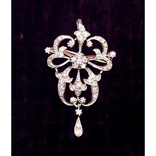 412 - A white metal diamond set openwork pendant/brooch in Bell Epoque style, 4.5cm