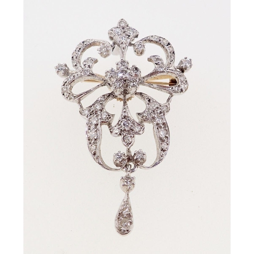 412 - A white metal diamond set openwork pendant/brooch in Bell Epoque style, 4.5cm