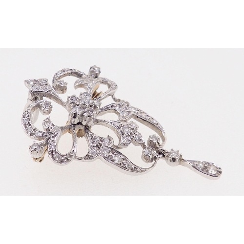 412 - A white metal diamond set openwork pendant/brooch in Bell Epoque style, 4.5cm