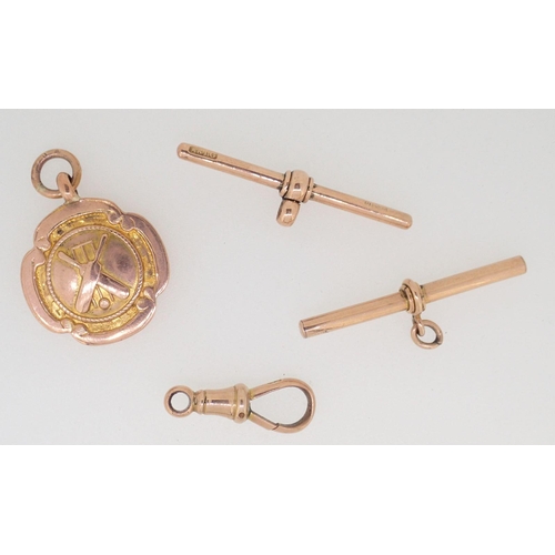 420 - A 9 carat gold cricket bat and stumps medal and three 9 carat gold fob fittings, 9.5g