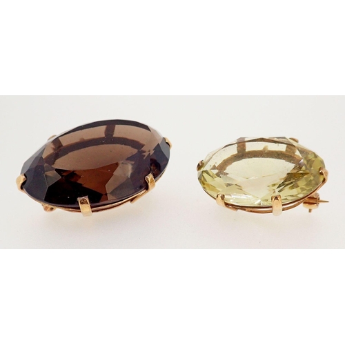 422 - Two 9 carat gold brooches set citrine and smokey quartz, 4cm x 3cm wide each