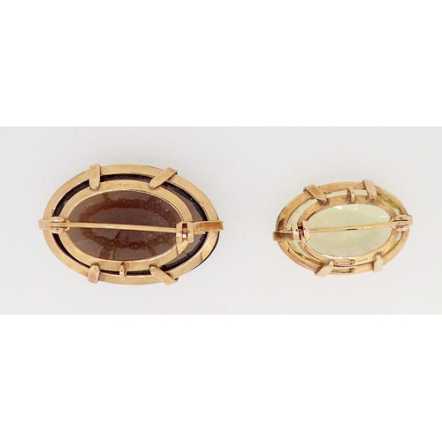 422 - Two 9 carat gold brooches set citrine and smokey quartz, 4cm x 3cm wide each