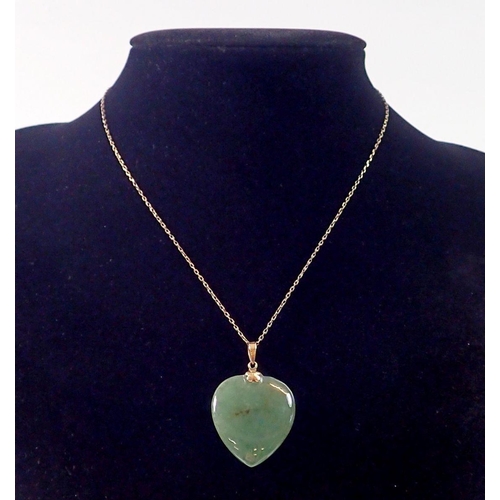 424 - A 14k gold Chinese jade heart form pendant 3cm drop on 14k gold chain 46cm long