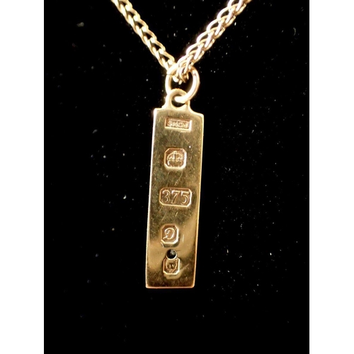 427 - A 9 carat gold miniature diamond set ingot 2.2cm  on 9 carat gold chain, 4.2g 38cm long