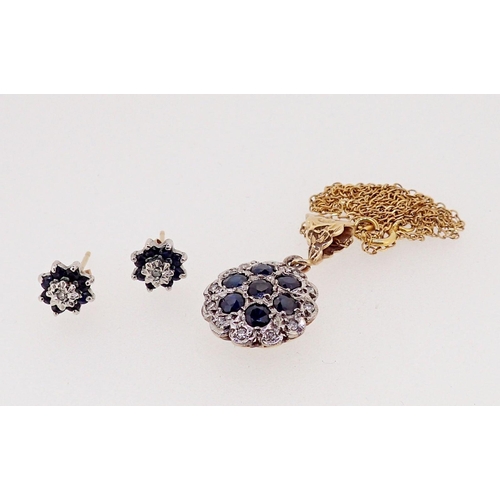 438 - A 9 carat gold circular pendant set sapphires and diamonds and pair of similar earrings