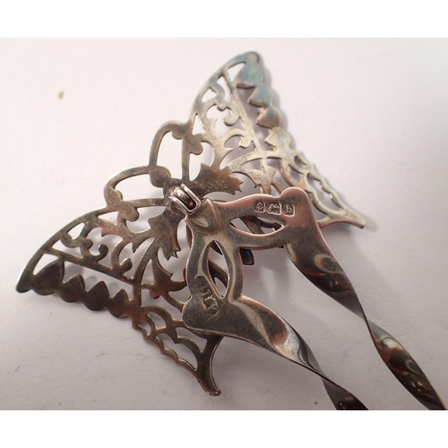 493 - A silver butterfly hair comb, 10.5cm and a white metal filigree brooch