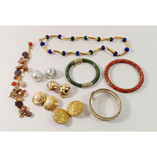 506 - A box of costume jewellery including bangles