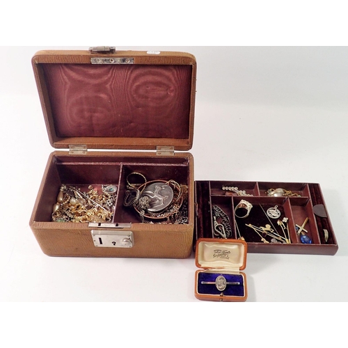 517 - An old leather jewellery box and contents of costume jewellery