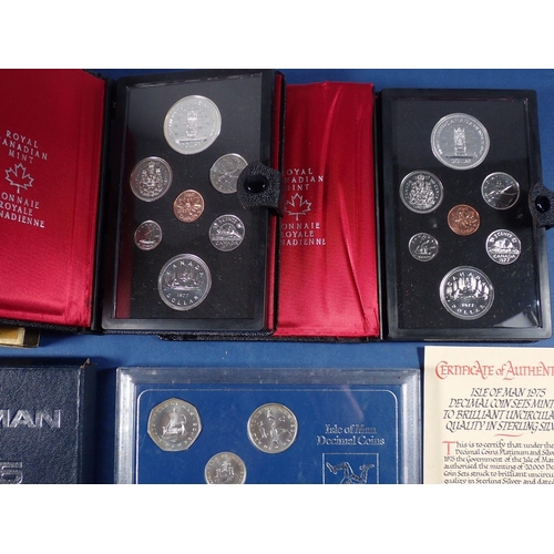 587 - A miscellaneous box of coins including Isle of Man sterling silver decimal coin set 1975 limited iss... 