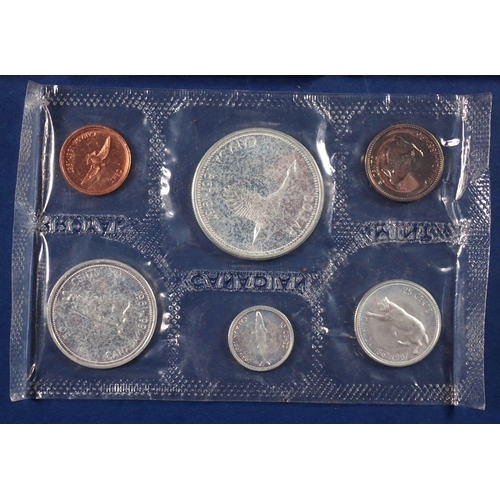 587 - A miscellaneous box of coins including Isle of Man sterling silver decimal coin set 1975 limited iss... 