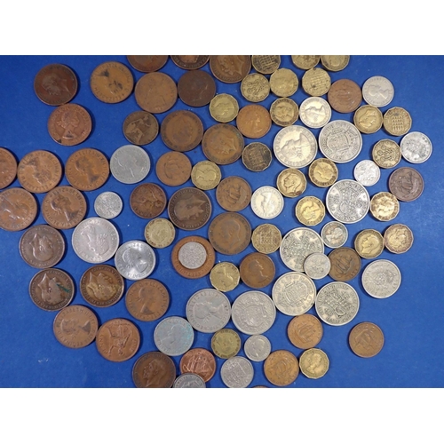 589 - A quantity of British coins including 113g pre 1947 silver content half crowns, florin and shilling,... 