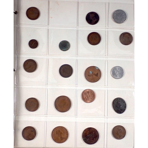 599 - A coin album of British and world coins to include Charles II copper farthing, George IV and William... 