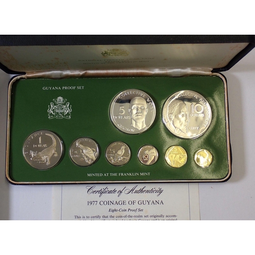 610 - A group of five coin sets including Franklin Mint Guyana 1977 proof set, 10 dollar sterling silver, ... 