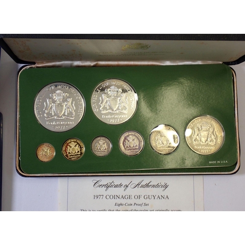 610 - A group of five coin sets including Franklin Mint Guyana 1977 proof set, 10 dollar sterling silver, ... 