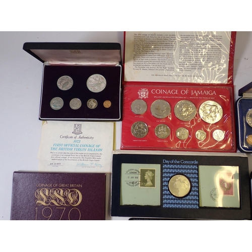 613 - A group of seven coin sets including 1973 & 1975 British Virgin Islands containing silver one dollar... 