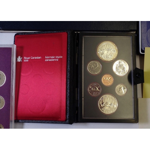 613 - A group of seven coin sets including 1973 & 1975 British Virgin Islands containing silver one dollar... 