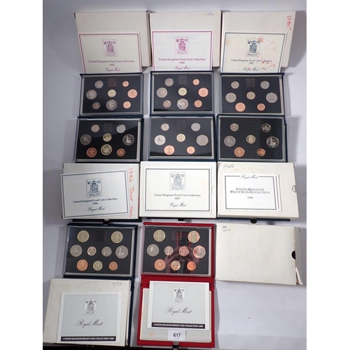 617 - A collection of Royal Mint coin sets including United Kingdom proof sets 1983-1989 plus a deluxe red... 