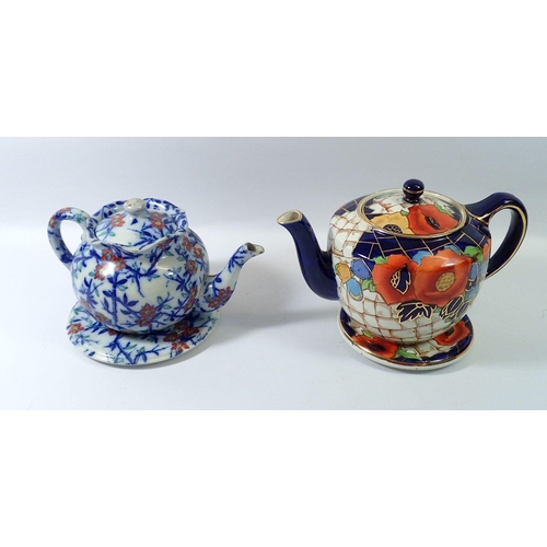 63 - An H J Wood Victorian ironstone teapot and a Losol Ware poppy one, both with stands