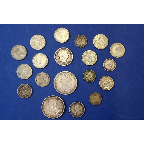 641 - A small group of silver content coins including George III one shilling 1819, Victoria 'Gothic' flor... 