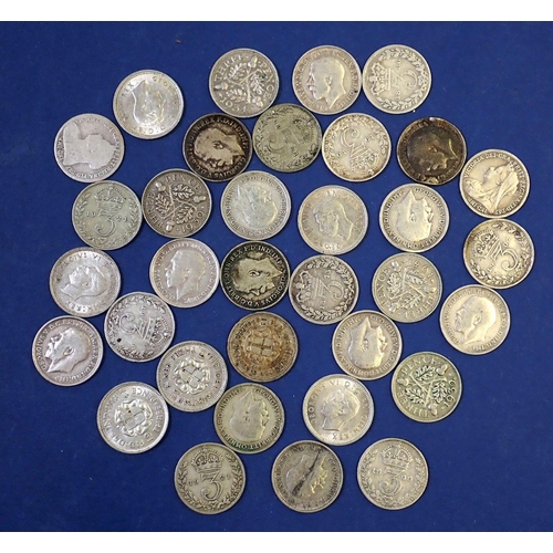 642 - A group of thirty four silver content threepence coins including Victoria - George VI, total weight ... 