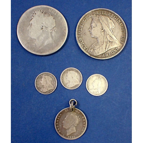 644 - A small group of silver coins to include George IV crown 1821, shilling with hole 1826, Victoria cro... 