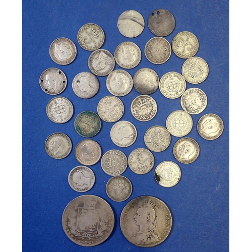 651 - A group of British silver coins including thirty one threepences Victoria - George VI some pierced p... 