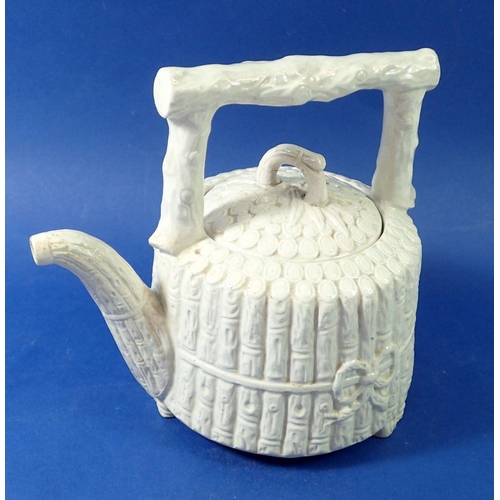 66 - A Victorian 'bamboo' pottery teapot with registration mark, 21cm tall