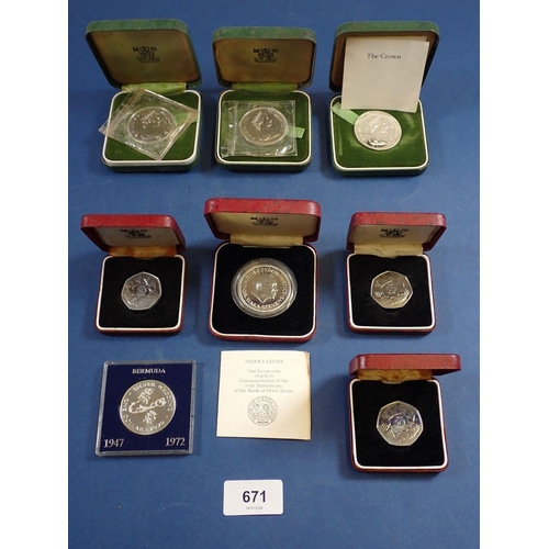 671 - A group of cased coins including silver Elizabeth II 1972 crowns x 3, 1974 Sierra Leone one leone, p... 