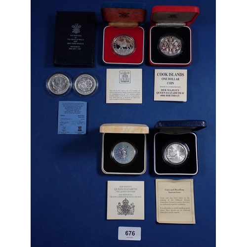 676 - A group of silver proof crowns to include 1980 80th Birthday Queen Mother, 1986 Cook Islands one dol... 