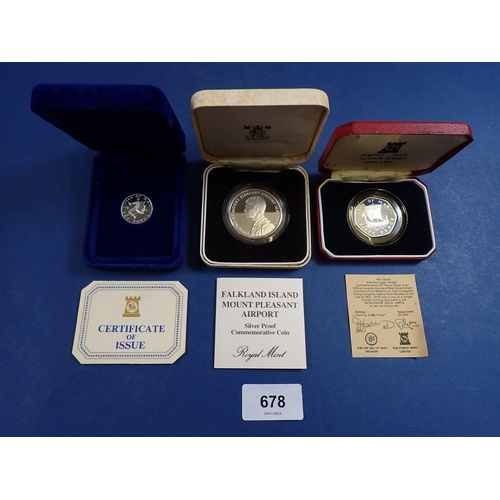 678 - Three silver proof coins including 1985 Falkland Island opening of Mount Pleasant Airport fifty penc... 