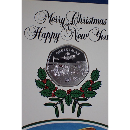 688 - Three Pobjoy Mint Isle of Man silver proof Christmas fifty pences each mounted in Christmas card, 19... 